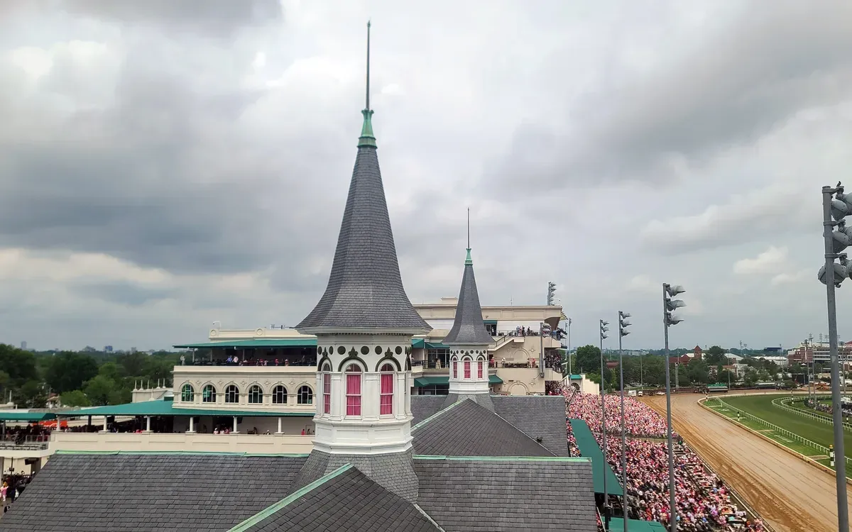 The Twin Spires atop the Churchill Downs grandstand in Louisville, with the racetrack beyond