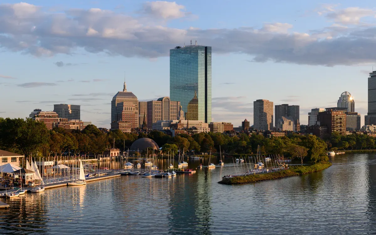 The Back Bay skyline over the Charles River in evening light, seen from the Longfellow Bridge
