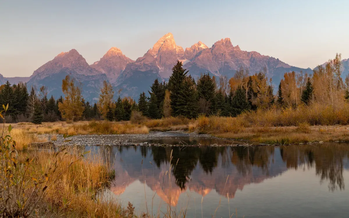 The Teton Range at sunrise reflected at Schwabacher Landing, Grand Teton National Park