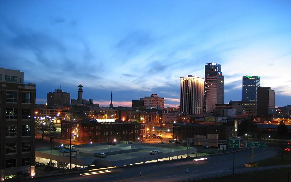 The Little Rock, Arkansas skyline lit up at night, viewed across the Arkansas River