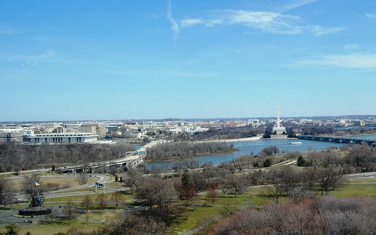 A wide panorama of the Washington, DC skyline across the Potomac River from Arlington, Virginia, with the Washington Monument, Lincoln Memorial, and Arlington Memorial Bridge in view