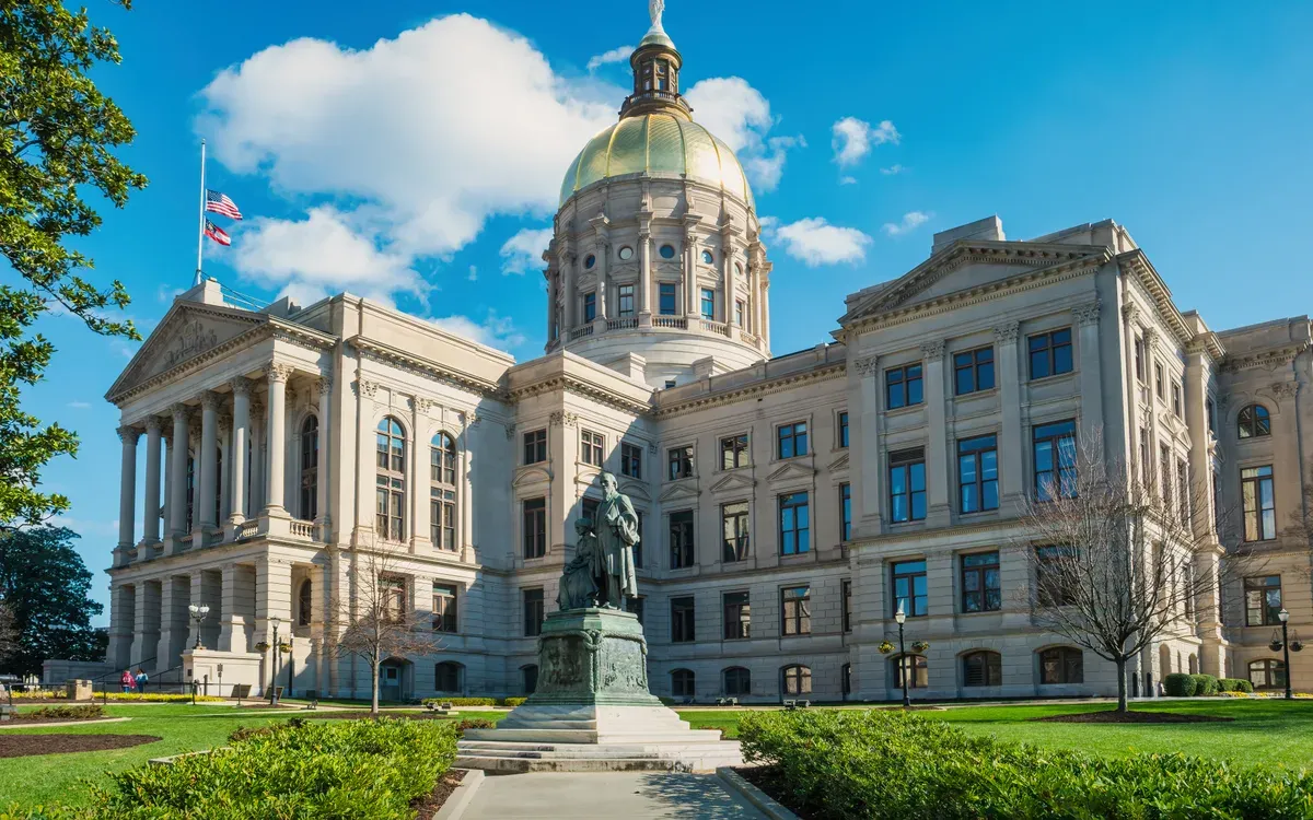 The gold dome of the Georgia State Capitol in Atlanta on a sunny day