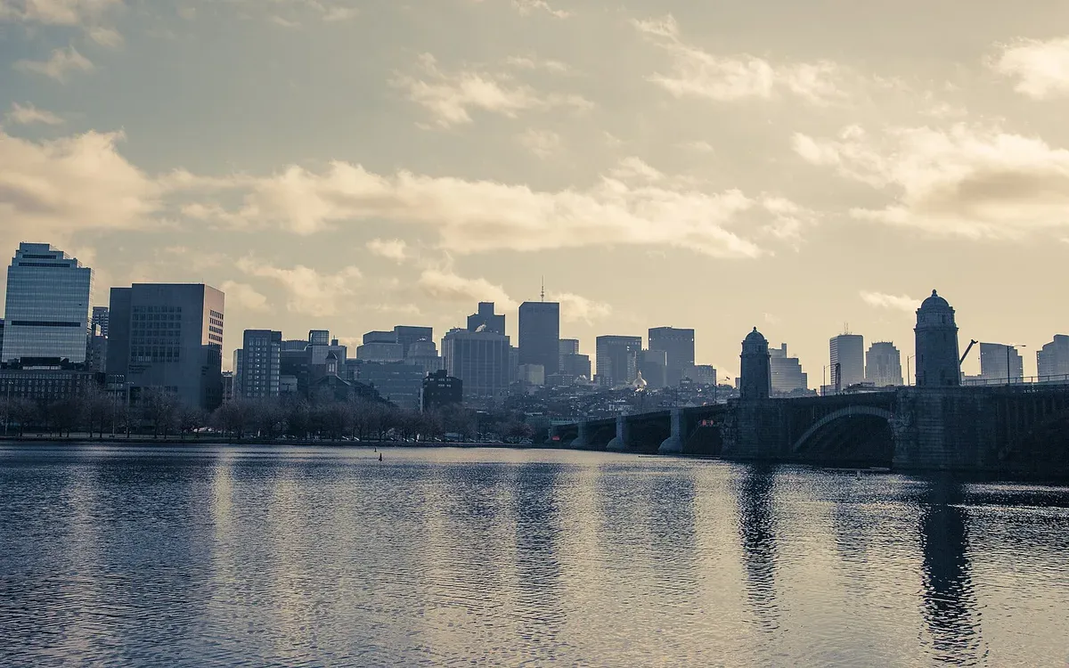 The Boston skyline and Charles River viewed from Cambridge, with the Longfellow Bridge crossing in the foreground