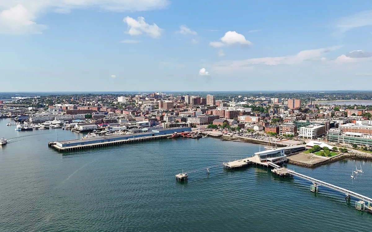 An aerial view of the Portland, Maine skyline and waterfront along Casco Bay