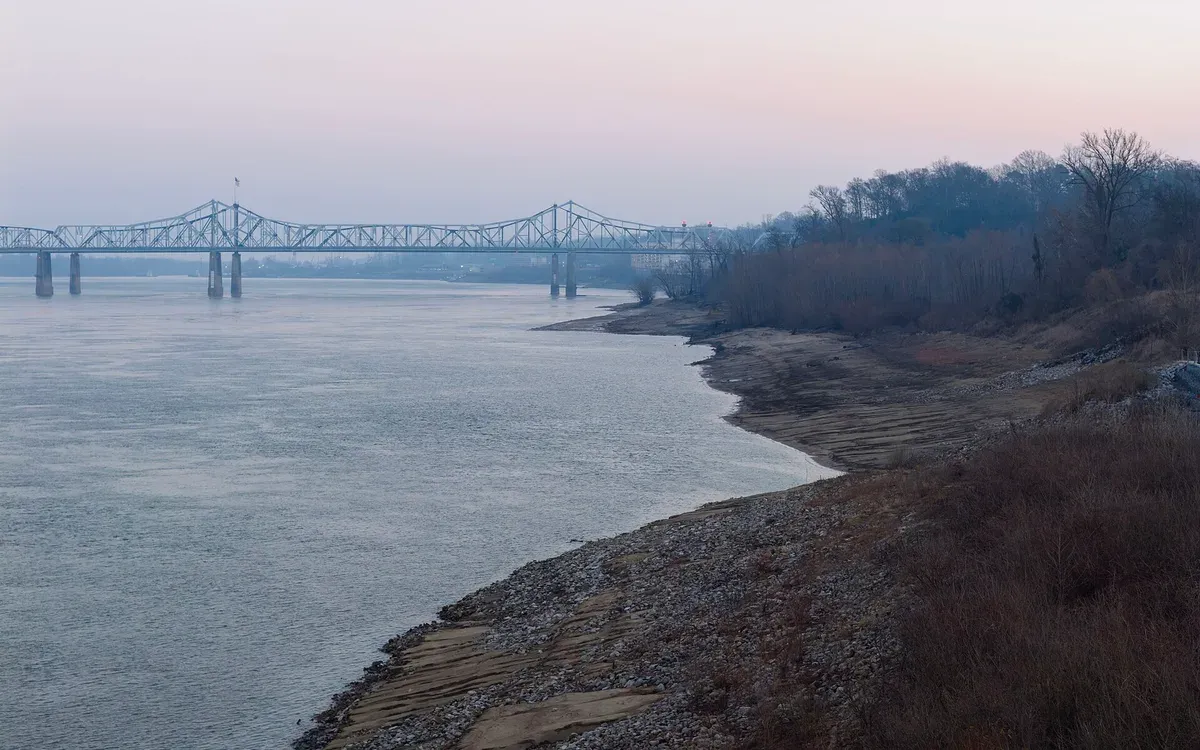 An aerial drone view of the Mississippi River Bridge along the riverbank near Vicksburg, Mississippi