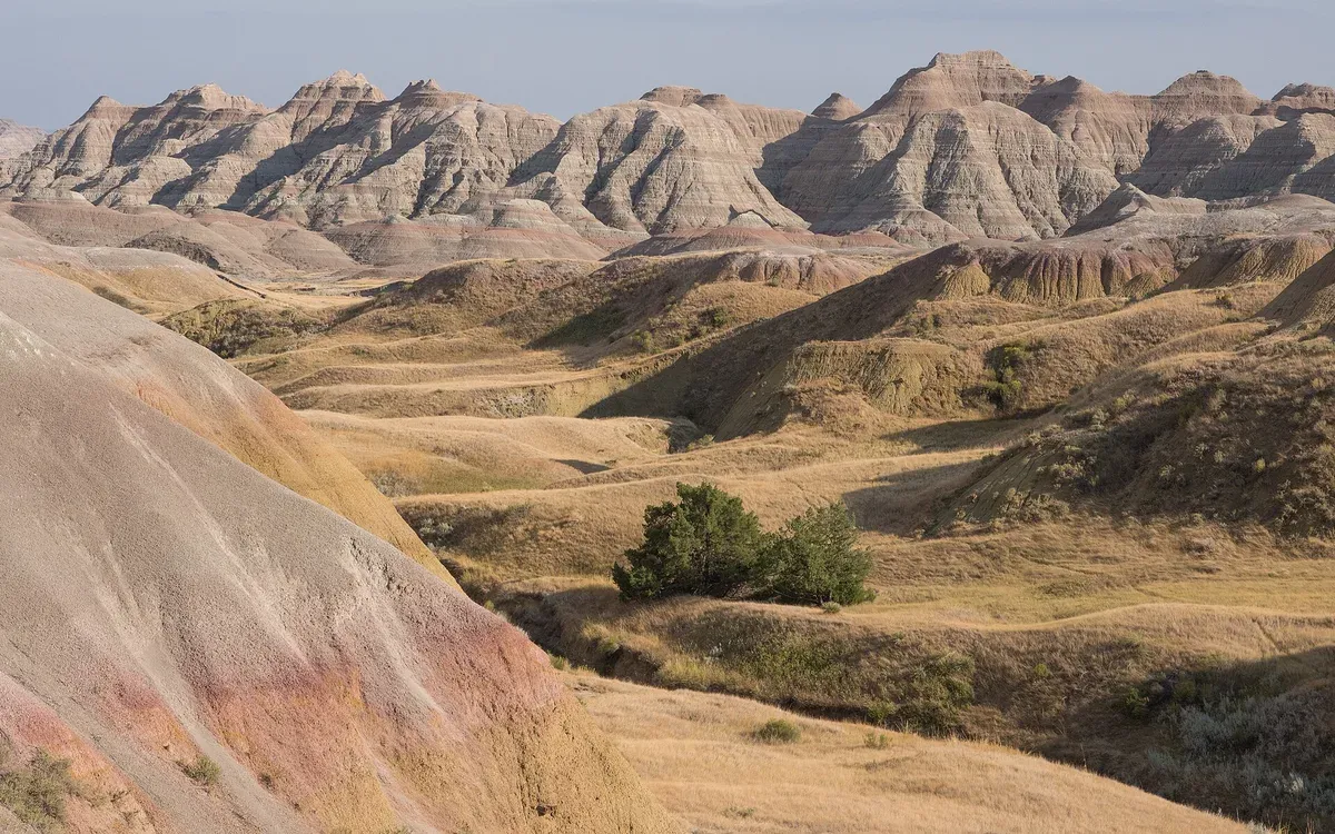 The layered, colorful buttes and mounds of the Yellow Mounds formation in Badlands National Park, South Dakota