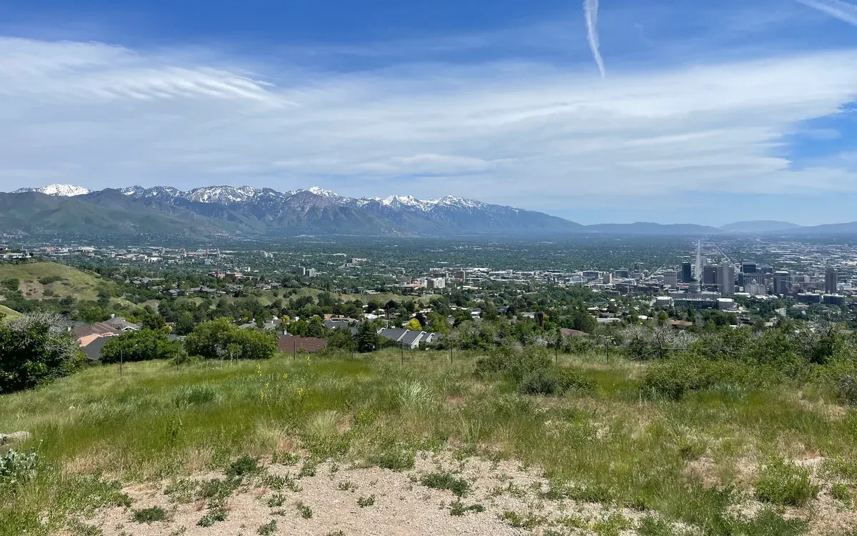 The Salt Lake City skyline with the Wasatch Mountains rising behind it