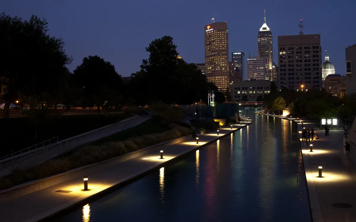 The Indianapolis Canal Walk at dusk, with the downtown skyline