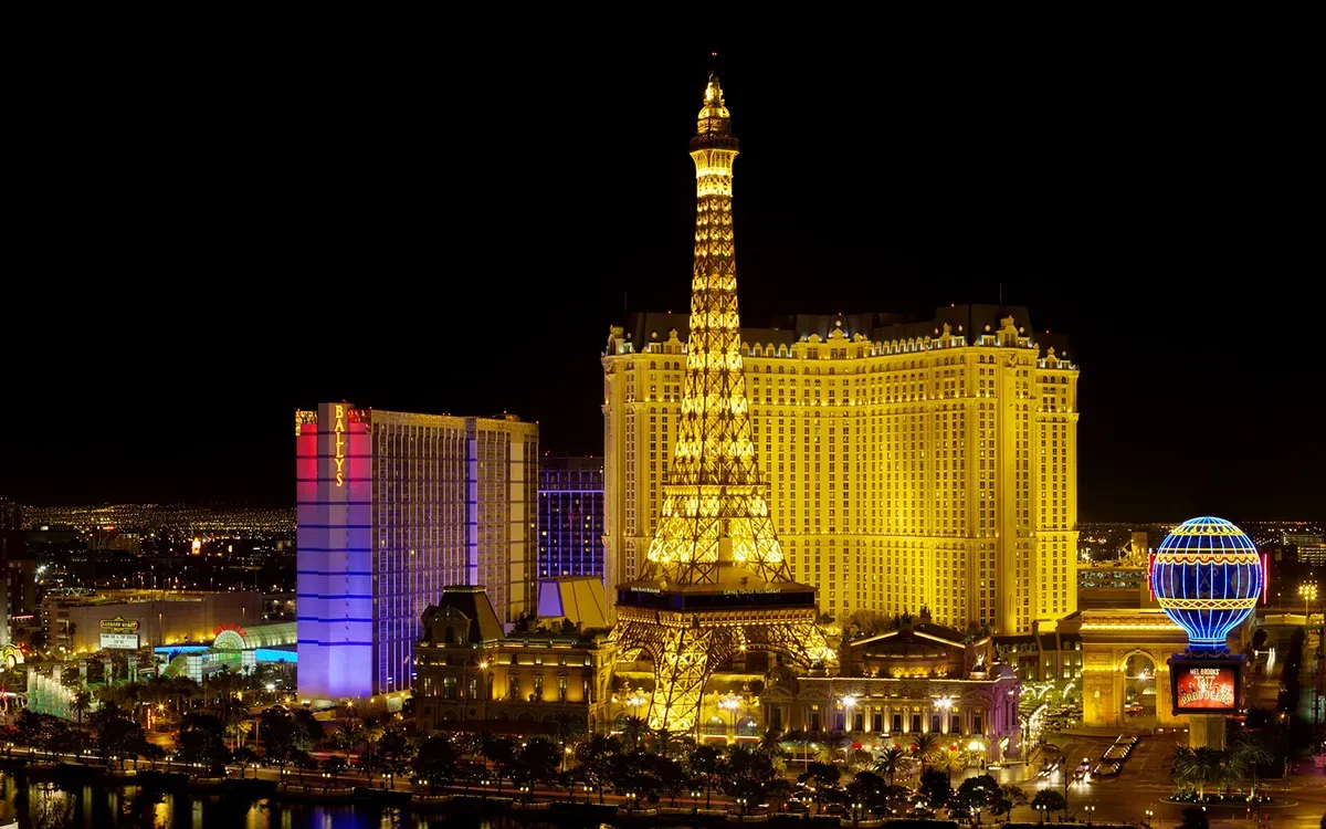 The Las Vegas Strip at night, with the Paris Las Vegas tower lit in gold