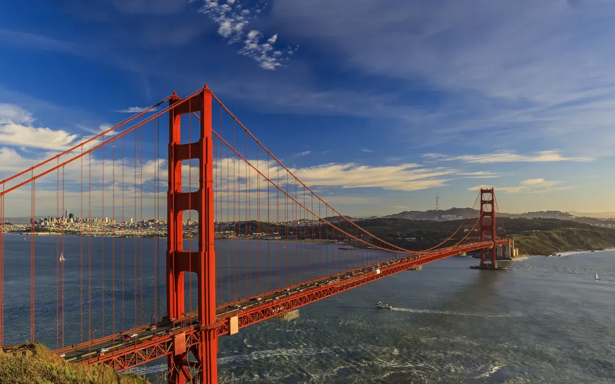 The Golden Gate Bridge and the San Francisco skyline at dusk