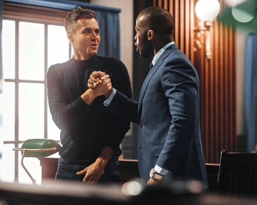 Client and attorney celebrating a successful court outcome